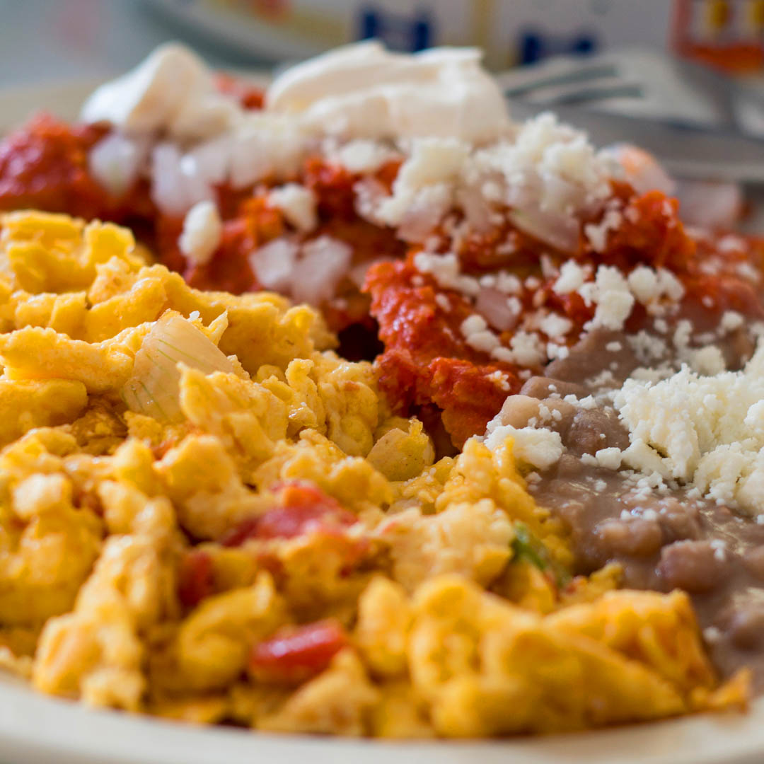 Scramble eggs with chilaquiles